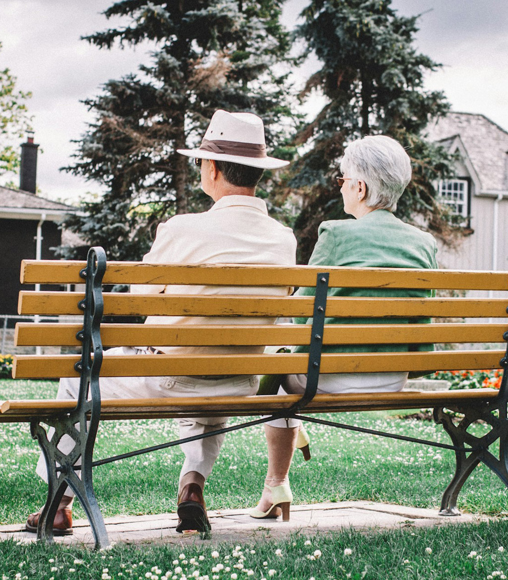 Senior citizens sitting on a park bench